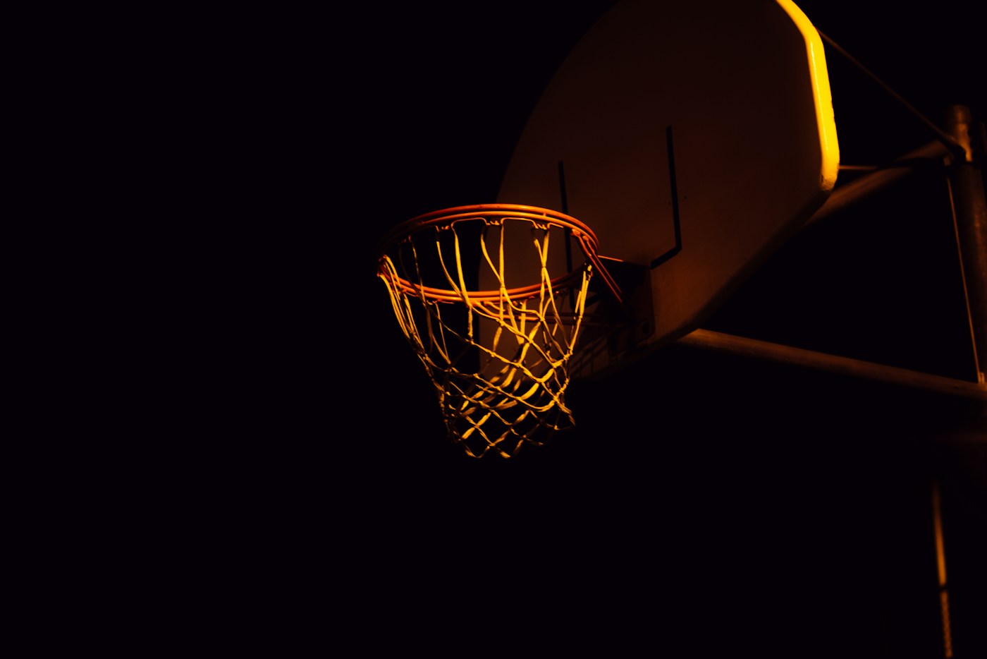 A basketball hoop in the dark